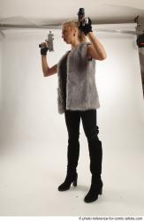 NIKOL STANDING POSE WITH TWO GUNS